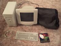 Apple Macintosh Performa 6400 with monitor/speakers and printer (covered)